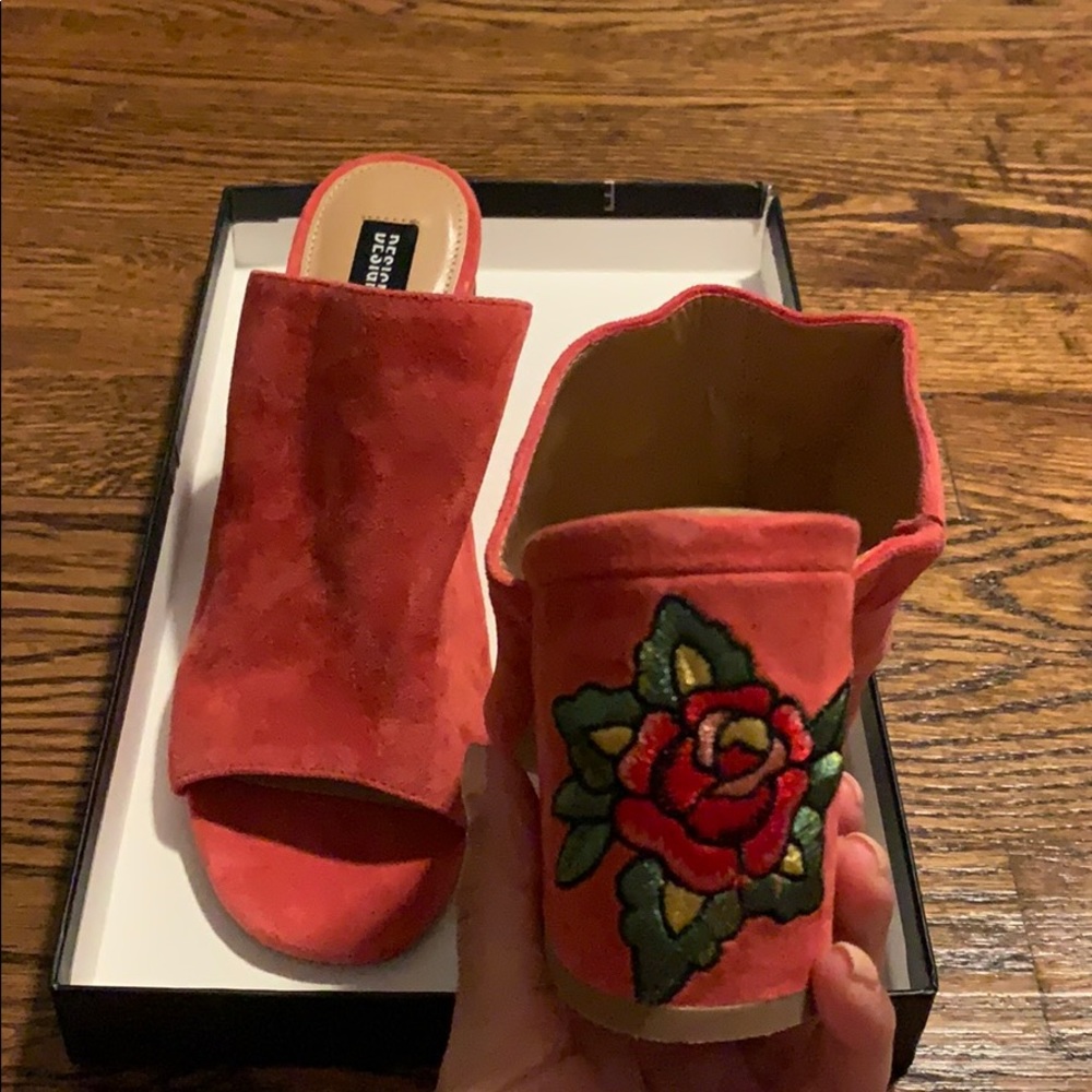 Red mules with floral design